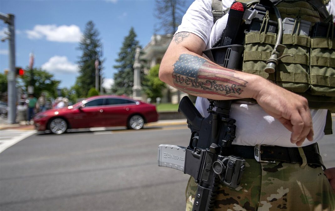 U.S. police chiefs grapple with new Election Day threat: armed men at the polls