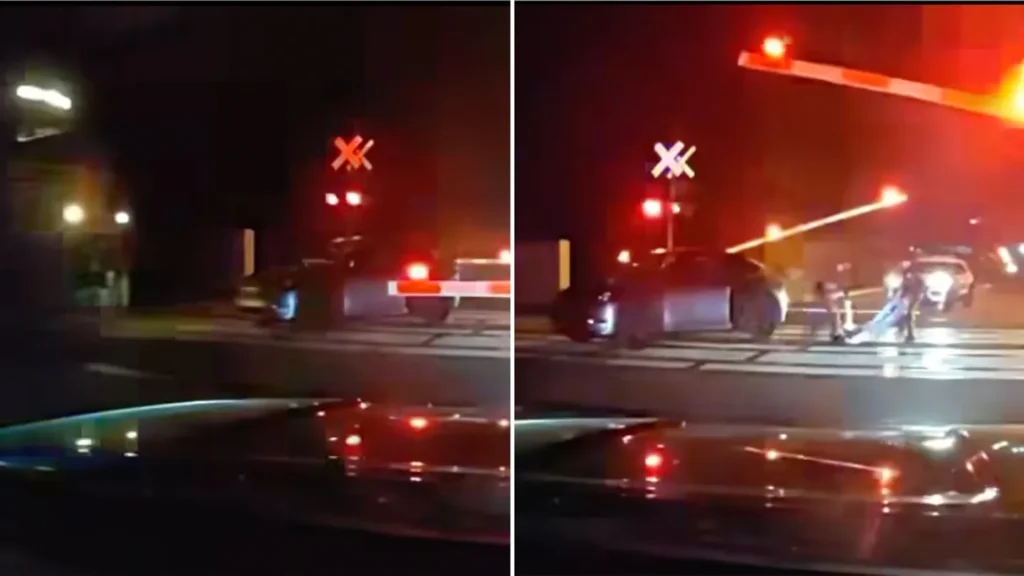 A Piscataway Township Police Department officer saves a man from an oncoming train. (Piscataway Township Police Department )